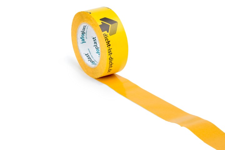 Eine Rolle gelbes Klebeband mit der Aufschrift "dicht-ist-dicht.de" und "jafoplast", teilweise abgerollt auf einer weißen Oberfläche.